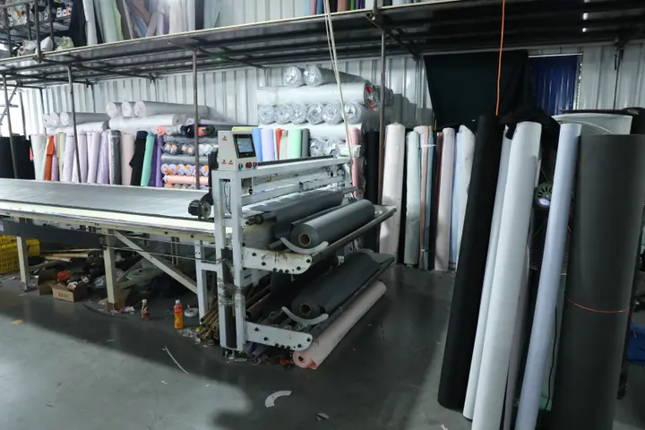 Fabric roll rack feeding the spreading machine